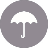 A white umbrella icon on a grey background circle
